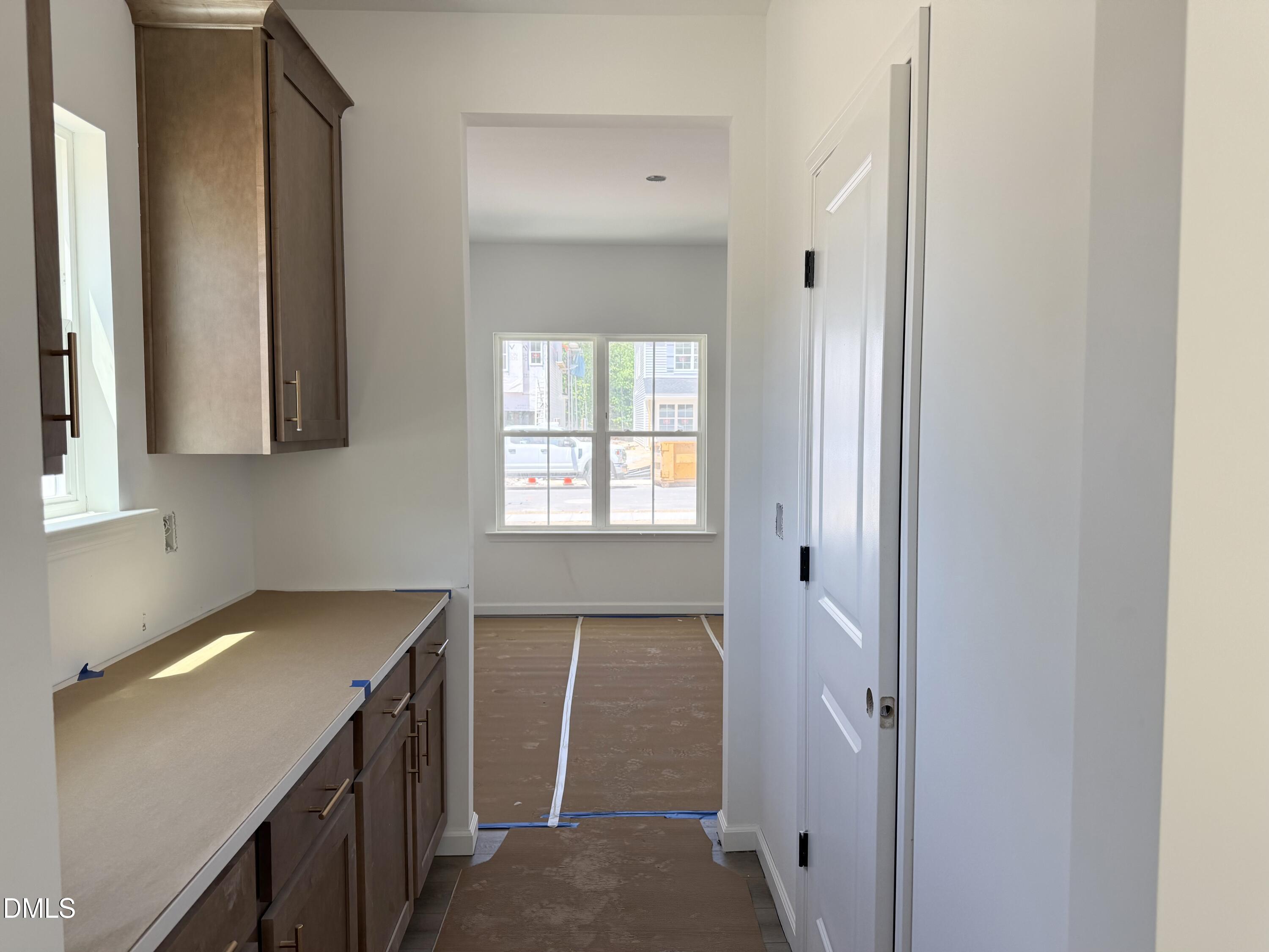 941 Fetching Place, Unit 370 Rolesville, NC 27571 - Photo 7 of 24 a view of a kitchen from the hallway