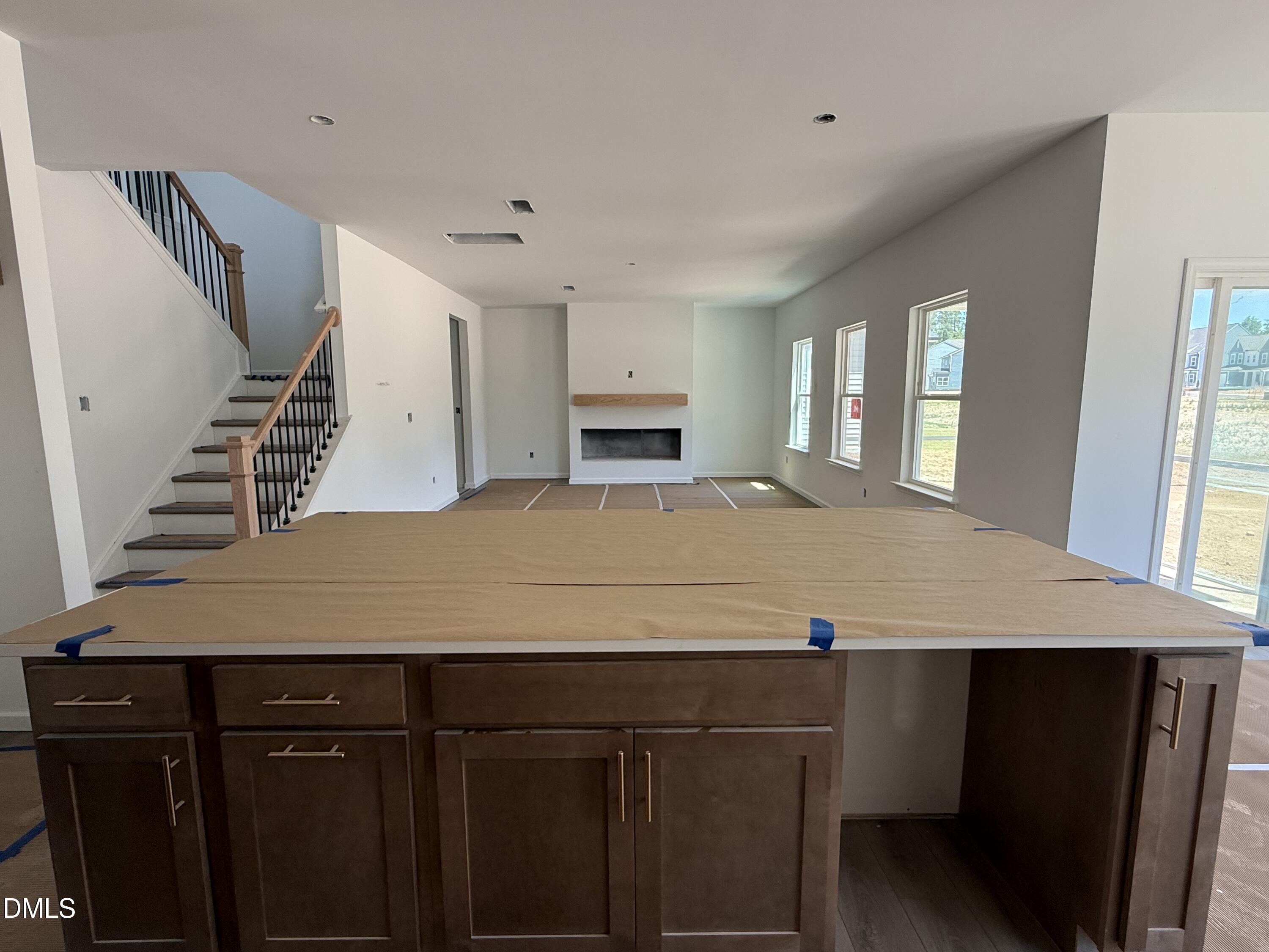 941 Fetching Place, Unit 370 Rolesville, NC 27571 - Photo 8 of 24 a view of a kitchen with cabinets and wooden floor