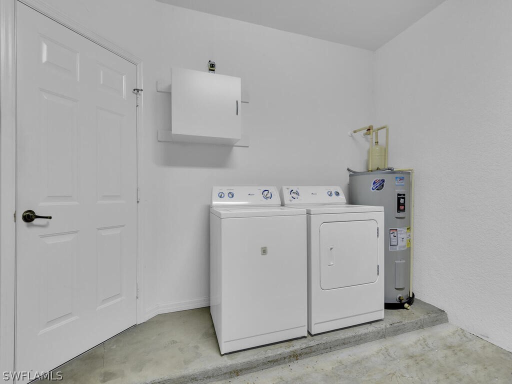 11740 Eros Road Lehigh Acres, FL 33971 - Photo 23 of 30 a utility room with dryer and washer