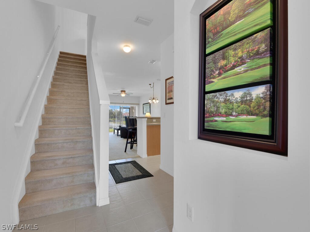 11740 Eros Road Lehigh Acres, FL 33971 - Photo 4 of 30 a view of entryway and hall with wooden floor