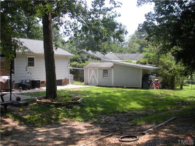 5822 Newhall Road Durham, NC 27713 - Photo 21 of 25 The Spacious Back Yard features a Patio, Wired storage shed, Space for a home garden and a 300 Gallon Rain Barrel Collector. Back Yard