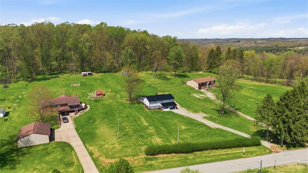 213 Fallen Timber Road Avella, PA 15312 - Photo 43 of 44 Ariel views capture the perfect country home, offering privacy and scenic beauty.