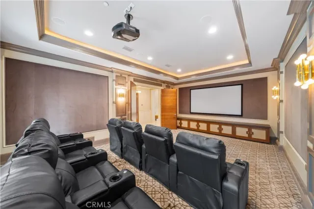 a large white kitchen with cabinets a sink a window and stainless steel appliances