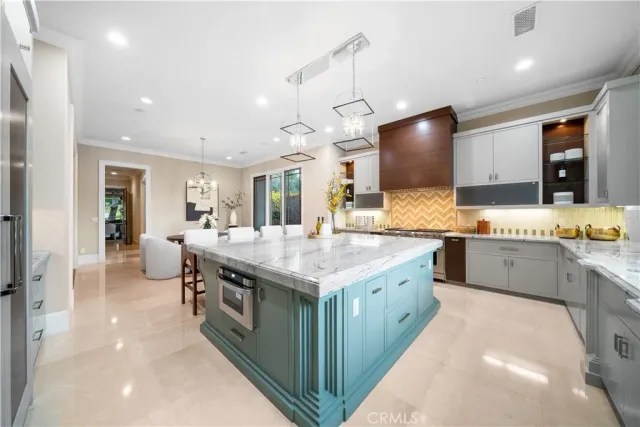 a kitchen with a sink a counter space and cabinets