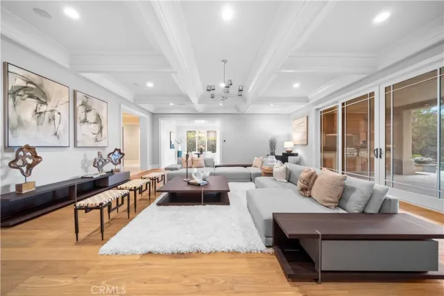 a front view of house with a garden and trees