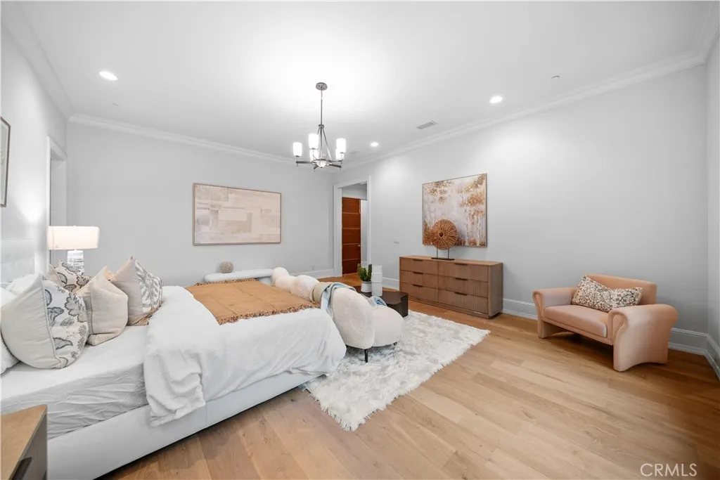 930 Fallen Leaf Road Arcadia, CA 91006 - Photo 42 of 63 a bedroom with furniture and a chandelier