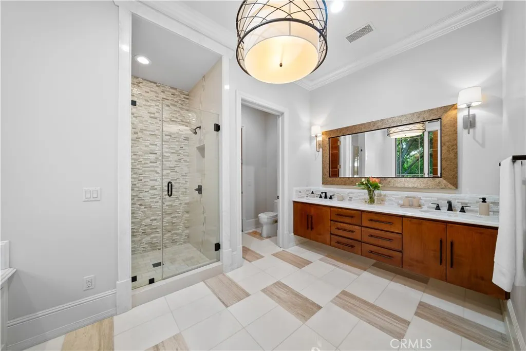 930 Fallen Leaf Road Arcadia, CA 91006 - Photo 43 of 63 a spacious bathroom with a double vanity sink and a mirror