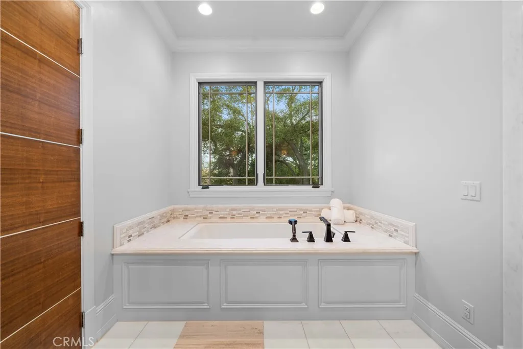 930 Fallen Leaf Road Arcadia, CA 91006 - Photo 46 of 63 a bathroom with a bathtub and next to a window
