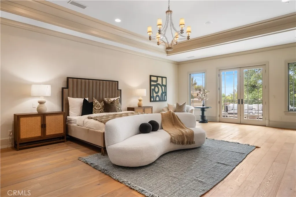 930 Fallen Leaf Road Arcadia, CA 91006 - Photo 48 of 63 a spacious bedroom with a bed and a chandelier