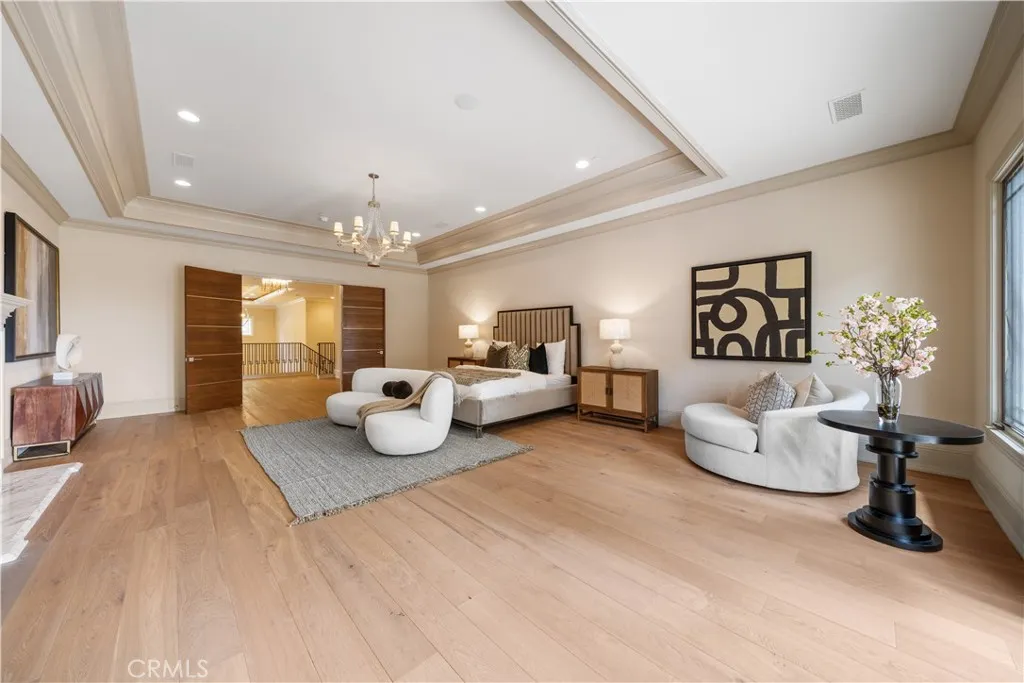 930 Fallen Leaf Road Arcadia, CA 91006 - Photo 49 of 63 a bedroom with furniture and a chandelier