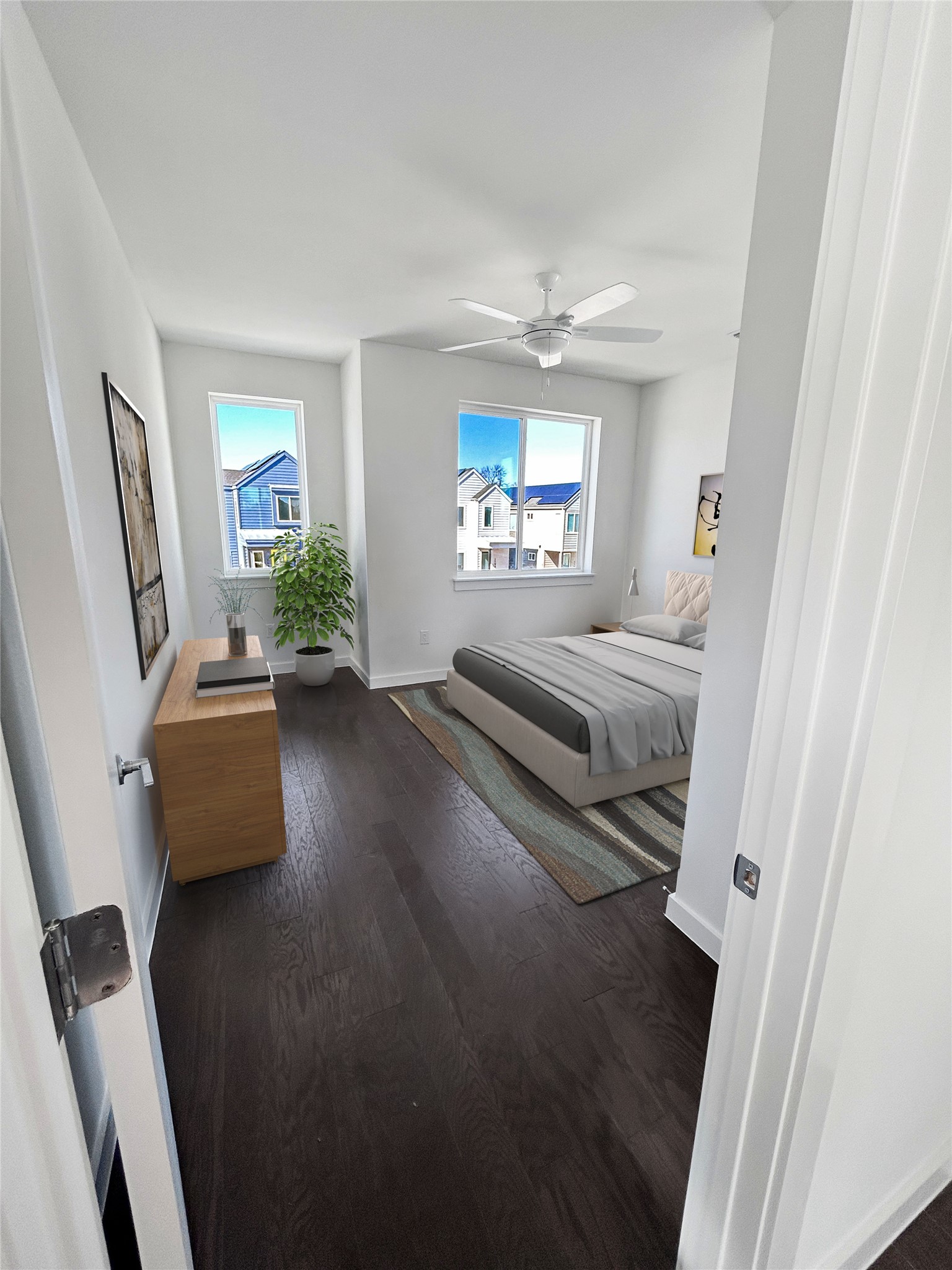 1191 Sarabeth Way Austin, TX 78721 - Photo 11 of 13 Bedroom with dark wood-type flooring, multiple windows, and a ceiling fan