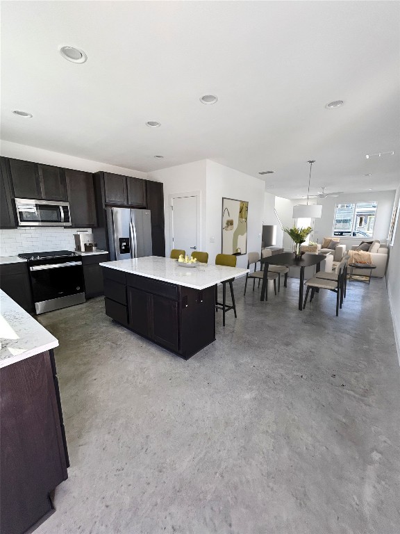 1191 Sarabeth Way Austin, TX 78721 - Photo 4 of 13 a living room with lots of furniture and kitchen view