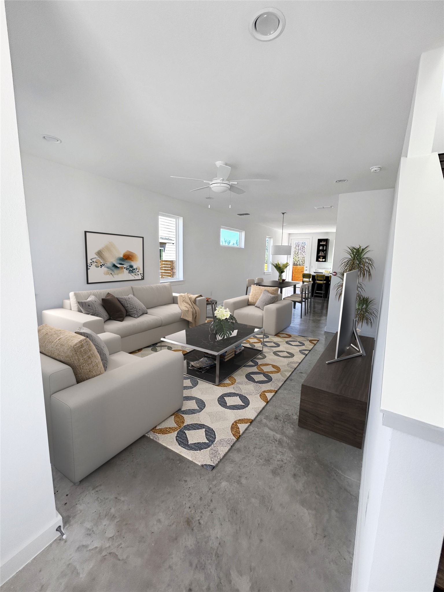 1191 Sarabeth Way Austin, TX 78721 - Photo 5 of 13 Living area with concrete floors and ceiling fan