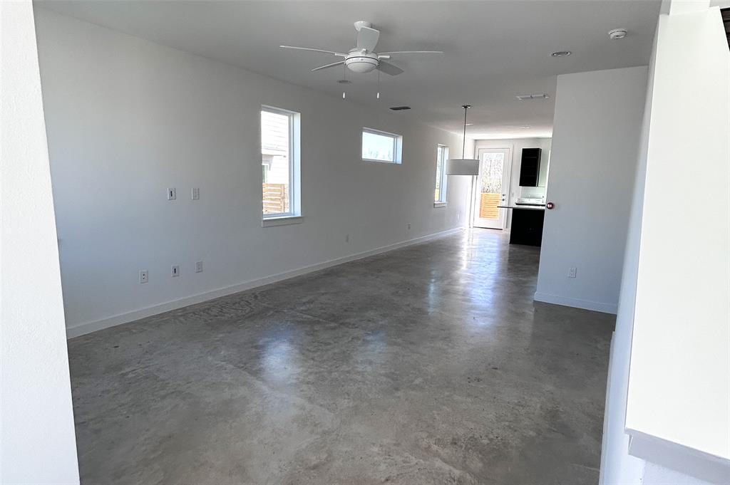 1191 Sarabeth Way Austin, TX 78721 - Photo 6 of 13 a view of a hallway with a kitchen
