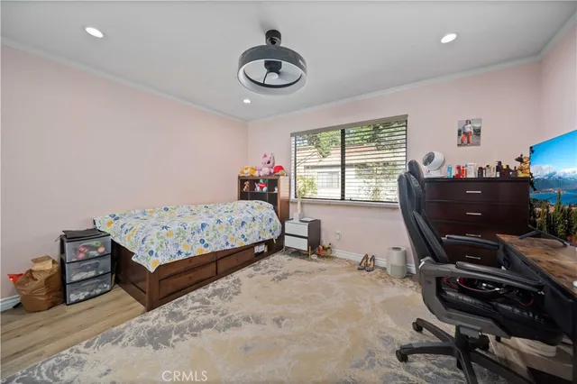 a bedroom with bed and a window