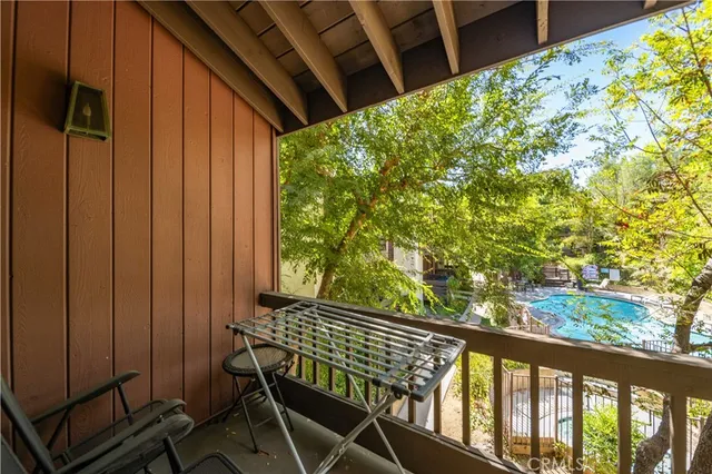 a view of balcony with wooden floor