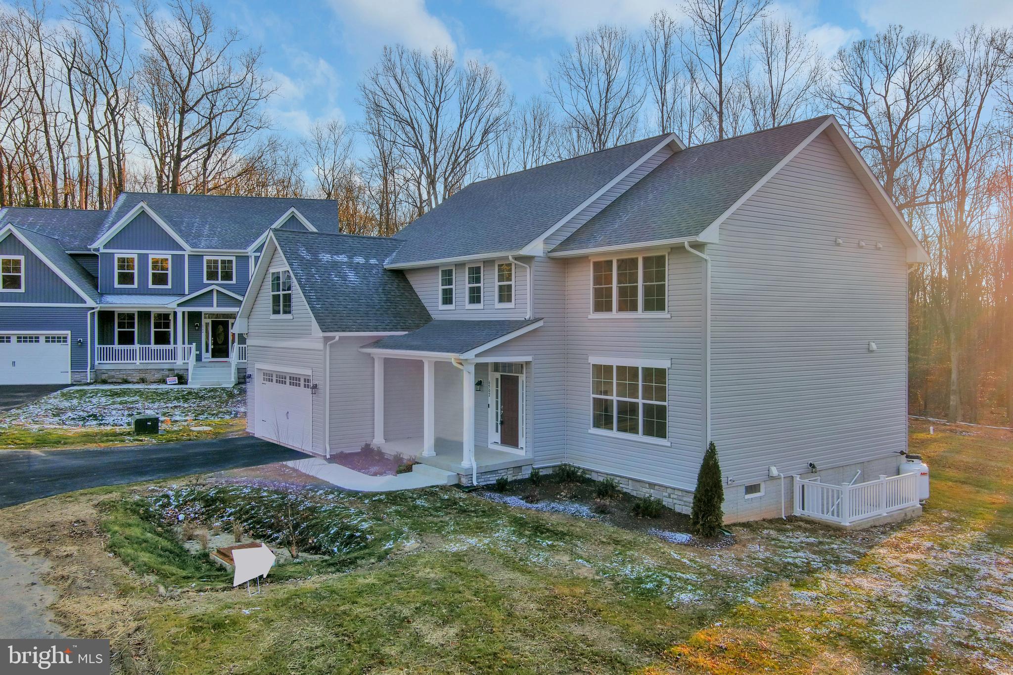 6502 Whitetail Xing Way Hanover, MD 21076 - Photo 41 of 58 front view of a house with a yard