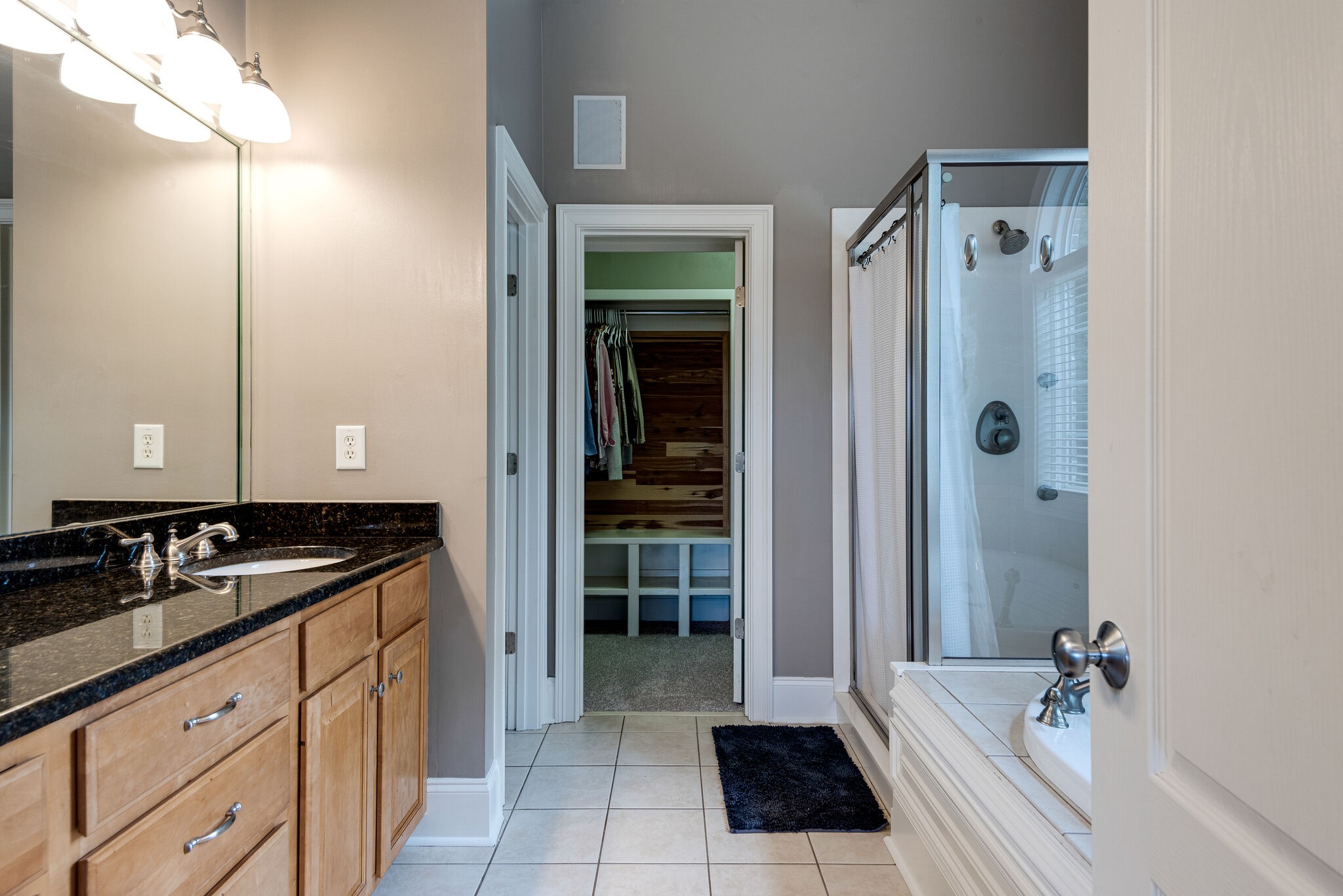 1623 Fair House Road Spring Hill, TN 37174 - Photo 14 of 35 a bathroom with a granite countertop sink a mirror and a shower