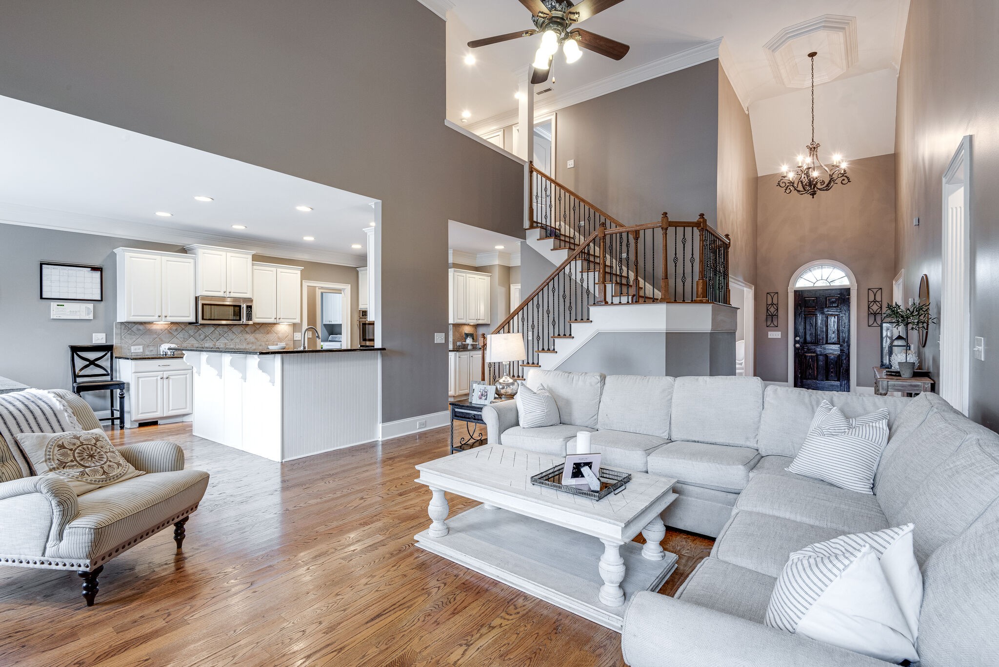 1623 Fair House Road Spring Hill, TN 37174 - Photo 7 of 35 a living room with furniture kitchen view and a wooden floor