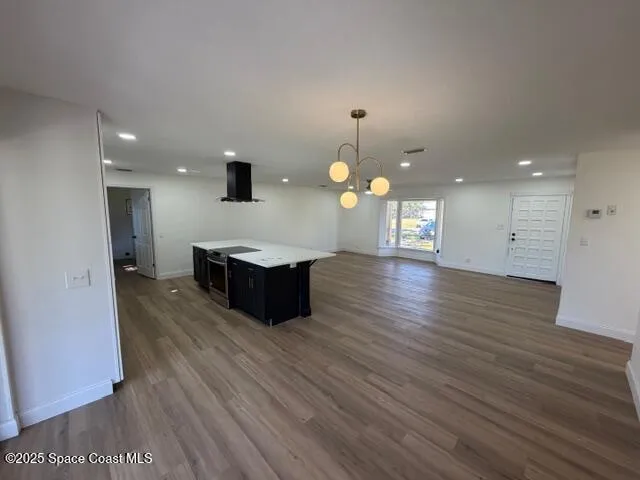 a living room with furniture and flat screen tv