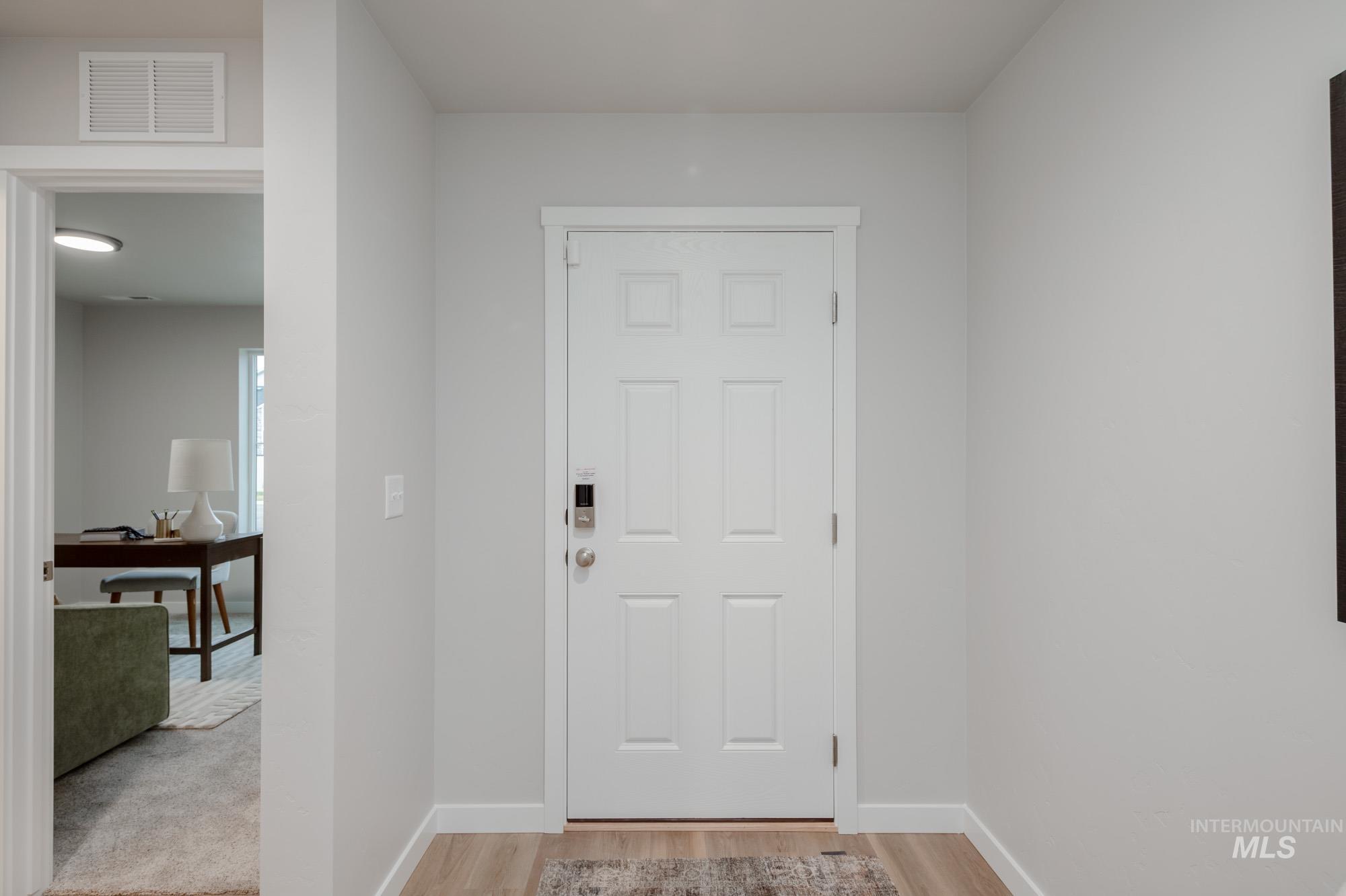 1760 West Unforgettable Street Meridian, ID 83642 - Photo 3 of 26 Foyer entrance with light wood finished floors