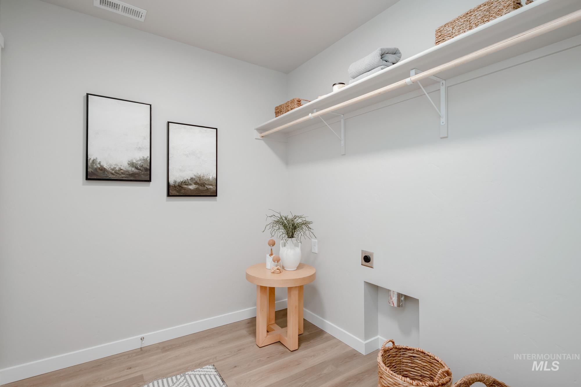 1760 West Unforgettable Street Meridian, ID 83642 - Photo 7 of 26 Laundry room with electric dryer hookup and wood finished floors