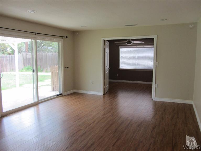 3192 Travis Avenue Simi Valley, CA 93063 - Photo 13 of 36 an empty room with wooden floor and windows