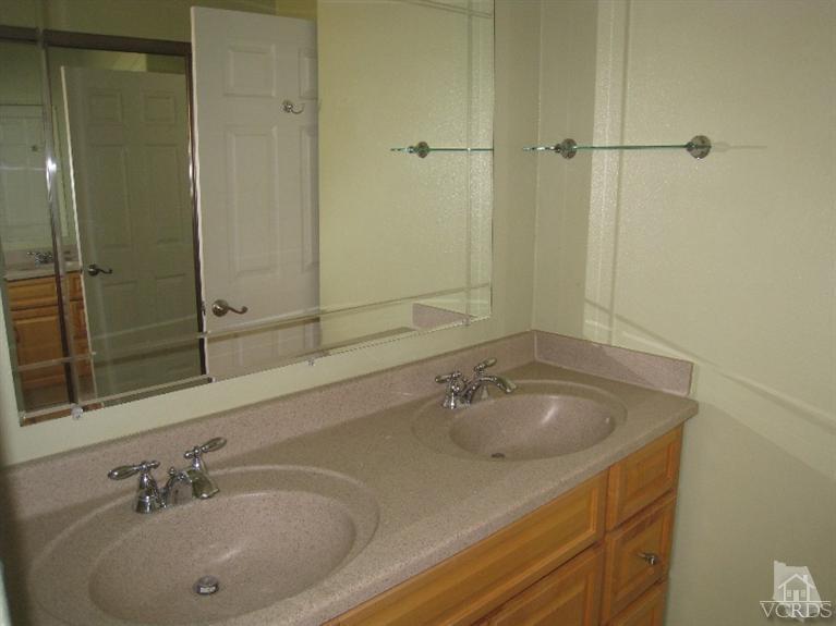3192 Travis Avenue Simi Valley, CA 93063 - Photo 19 of 36 a bathroom with a sink and a tub