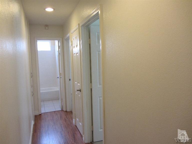 3192 Travis Avenue Simi Valley, CA 93063 - Photo 22 of 36 a view of a room with wooden floor and windows