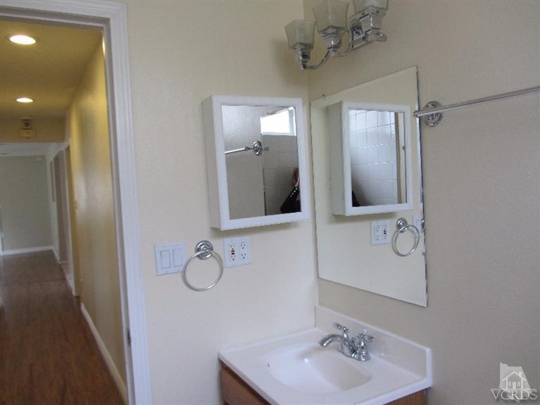 3192 Travis Avenue Simi Valley, CA 93063 - Photo 24 of 36 a bathroom with a sink and mirror