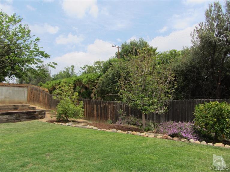 3192 Travis Avenue Simi Valley, CA 93063 - Photo 29 of 36 a backyard of a house with lots of green space