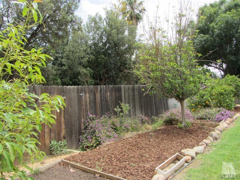 3192 Travis Avenue Simi Valley, CA 93063 - Photo 30 of 36 a garden with trees in front of it