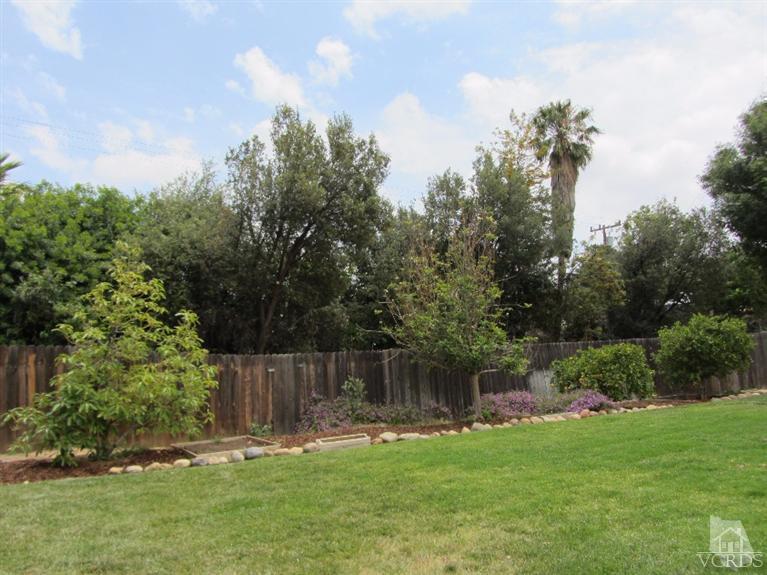 3192 Travis Avenue Simi Valley, CA 93063 - Photo 31 of 36 a backyard of a house with lots of green space
