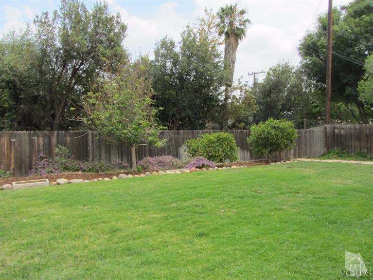 3192 Travis Avenue Simi Valley, CA 93063 - Photo 32 of 36 a backyard of a house with lots of green space
