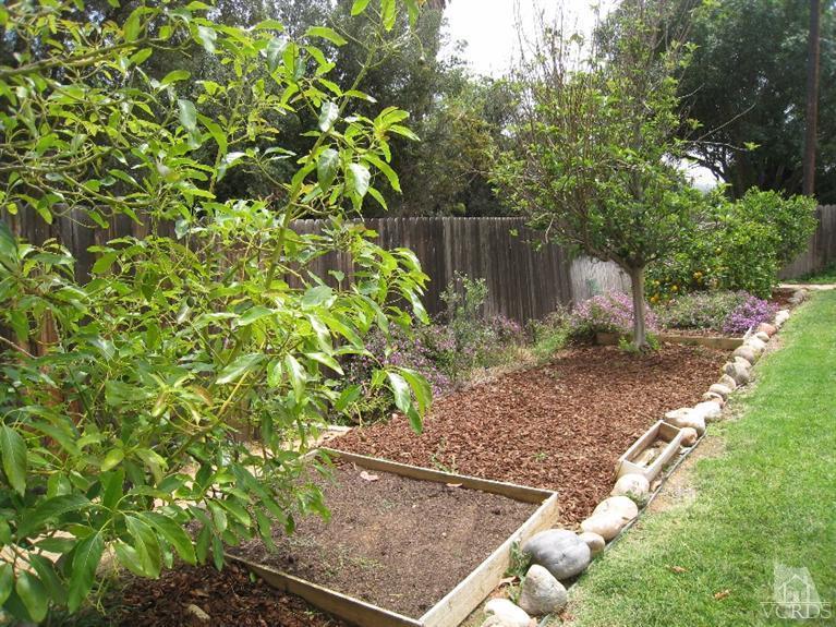 3192 Travis Avenue Simi Valley, CA 93063 - Photo 36 of 36 a backyard of a house with lots of green space