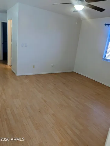 a view of a big room with wooden floor