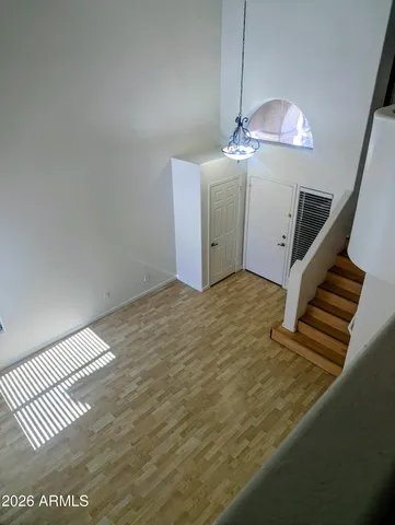 a view of a room with wooden floor