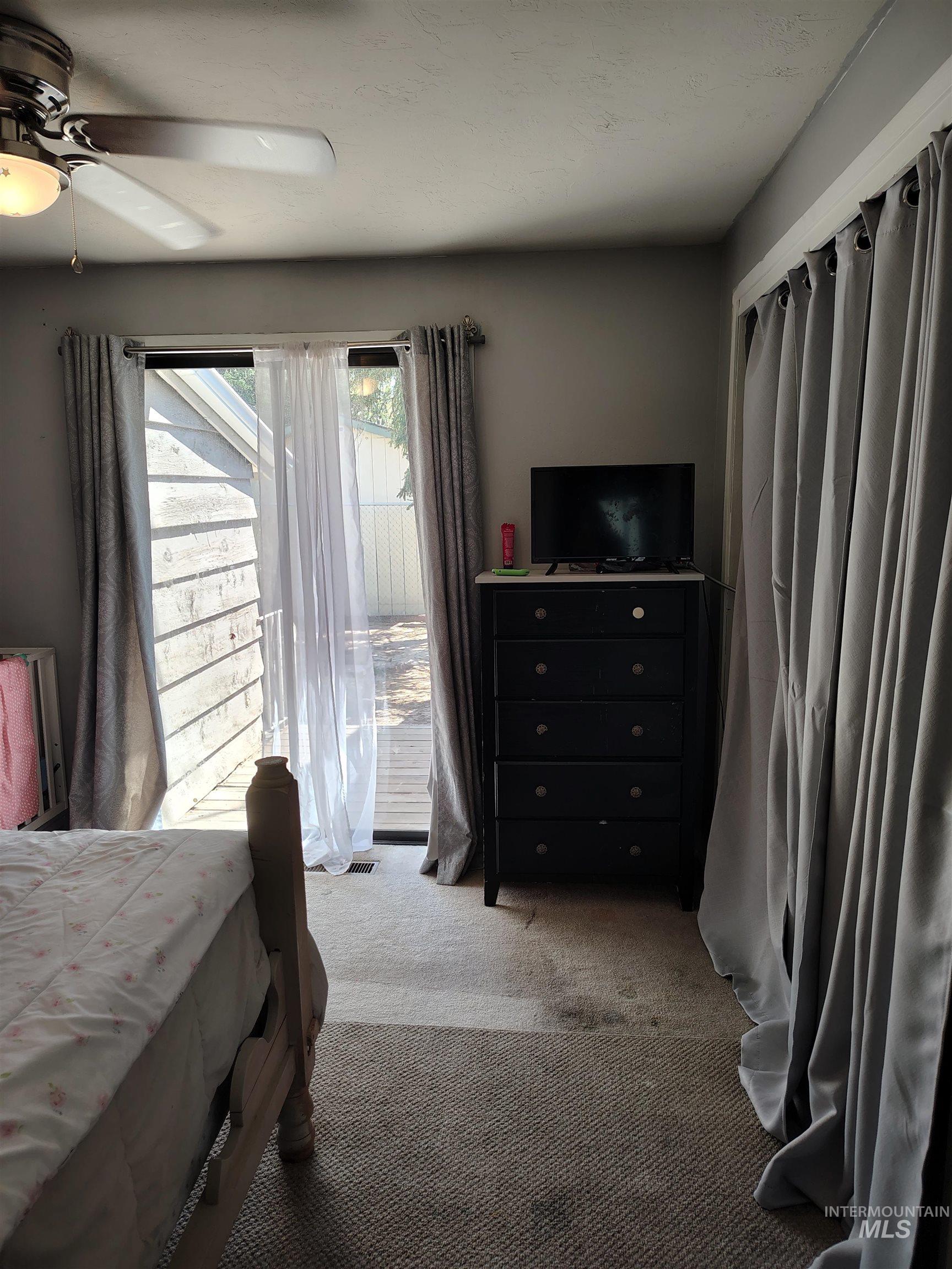 820 Meadows Drive Twin Falls, ID 83301 - Photo 22 of 23 Bedroom featuring light colored carpet and a ceiling fan