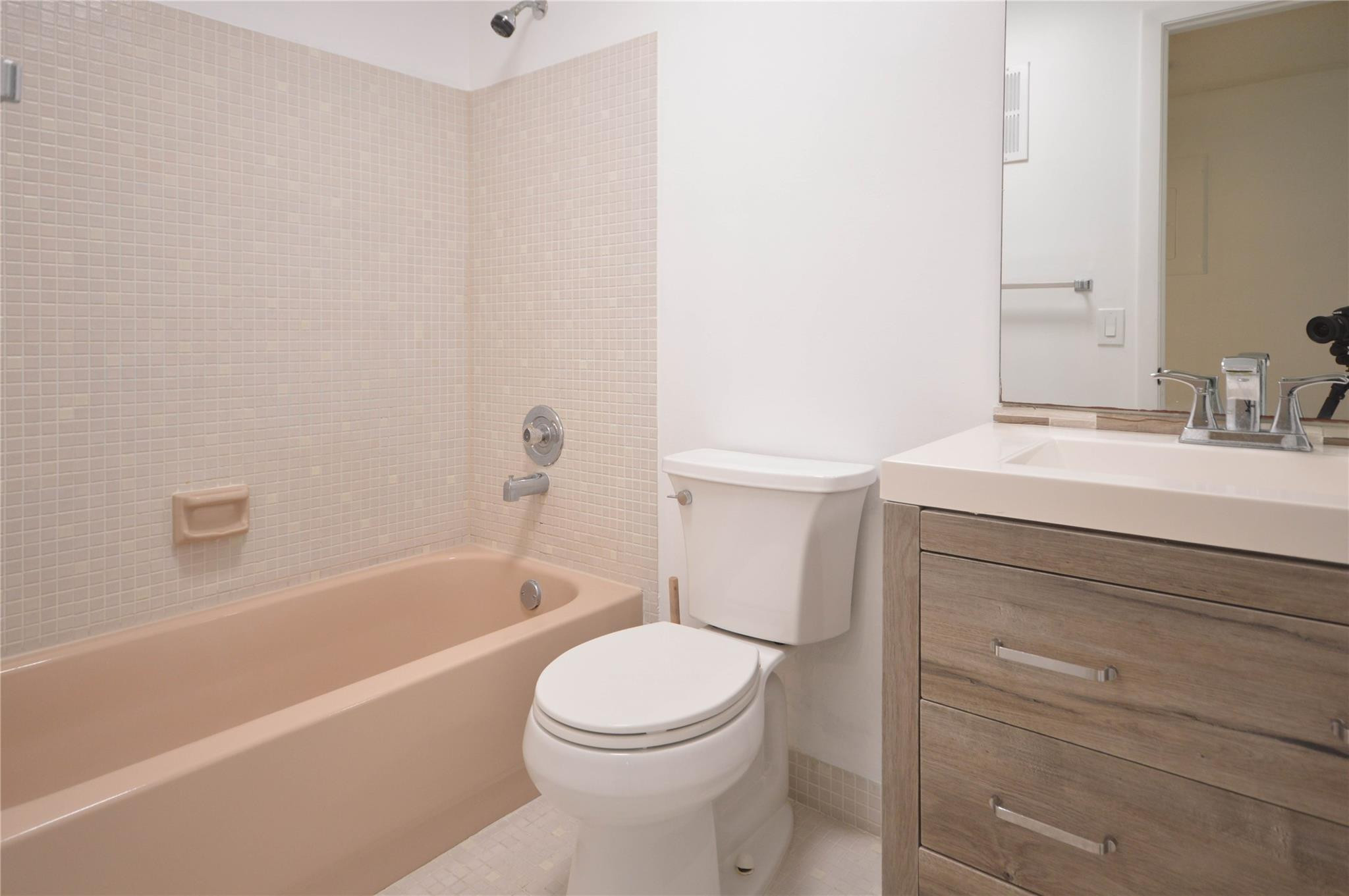 9499 West McNab Road, Unit 208 Tamarac, FL 33321 - Photo 10 of 19 a bathroom with a sink a toilet and bathtub