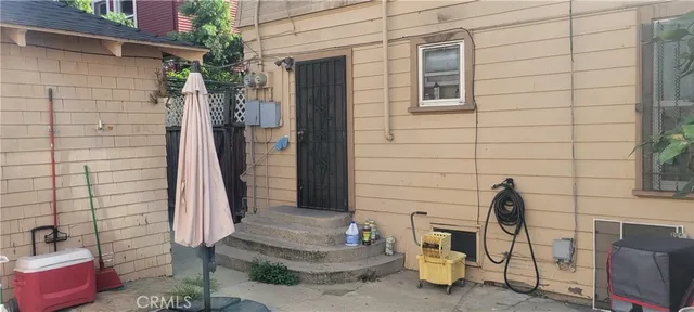 a front view of a house with outdoor seating