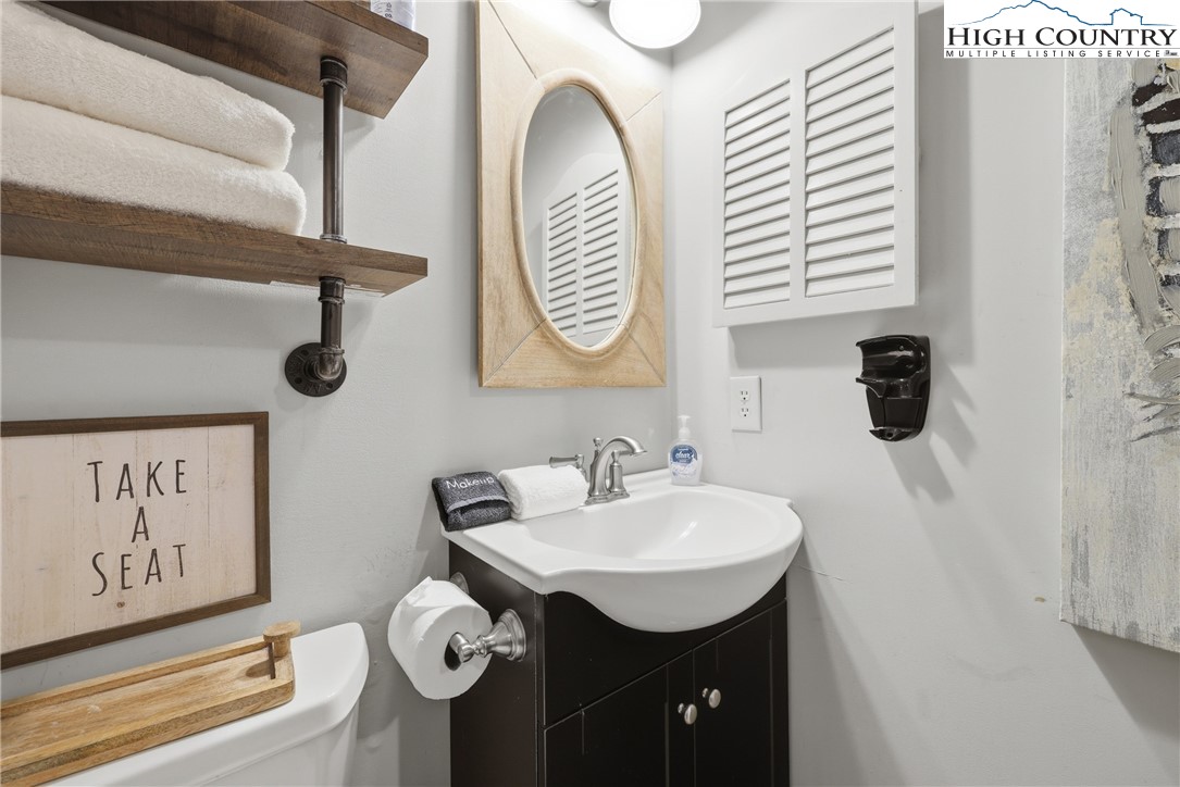 301 Pinnacle Inn Road, Unit 3301 Beech Mountain, NC 28604 - Photo 17 of 34 a bathroom with a sink and a mirror