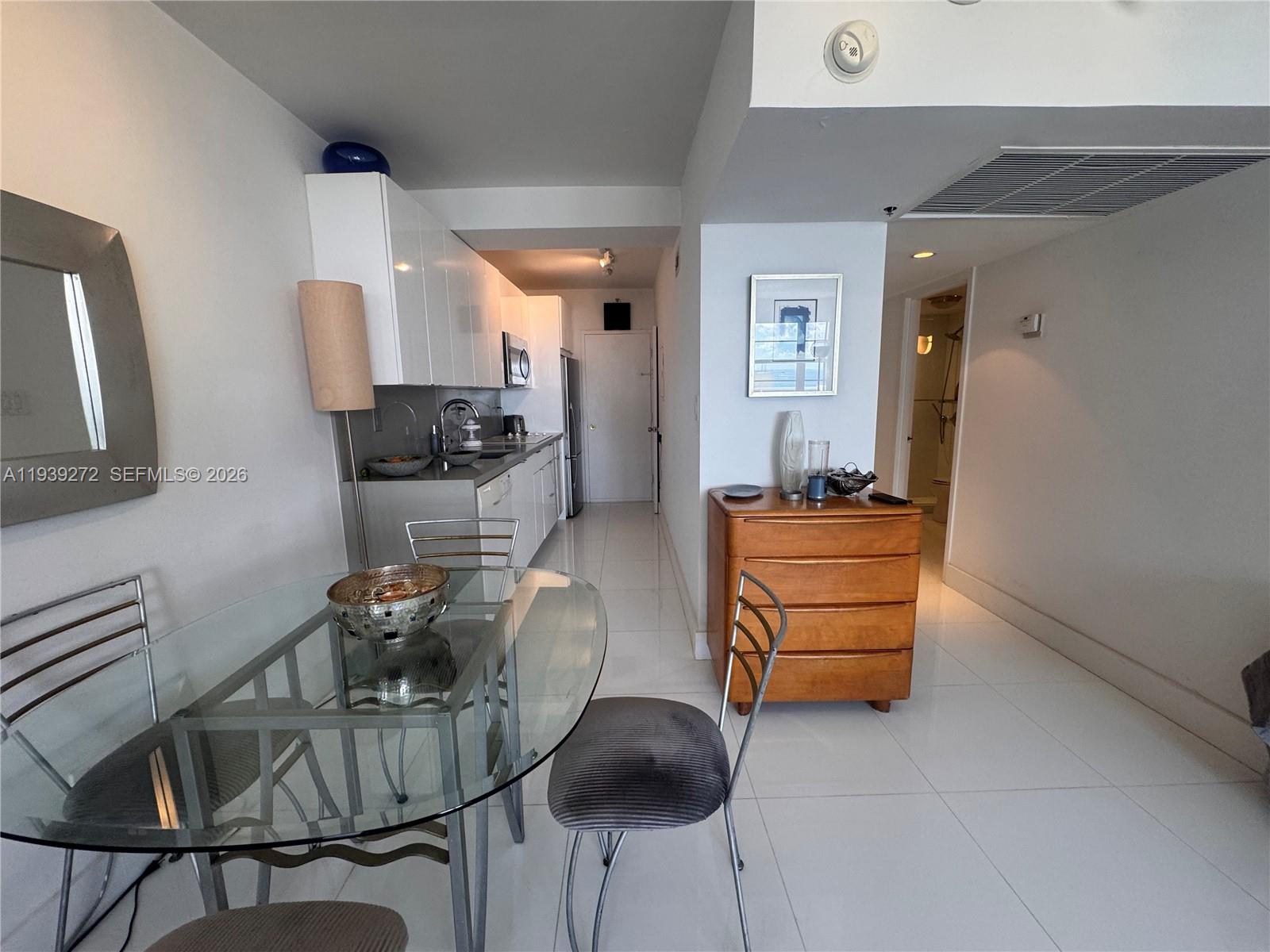 100 Lincoln Road, Unit 1230 Miami Beach, FL 33139 - Photo 11 of 38 a room with furniture a flat screen tv and dresser