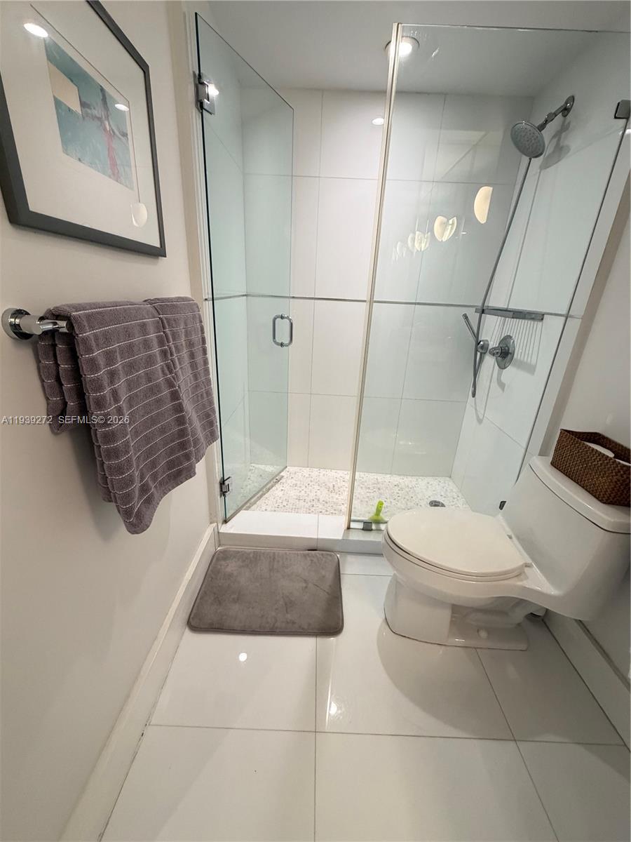 100 Lincoln Road, Unit 1230 Miami Beach, FL 33139 - Photo 14 of 44 a bathroom with a toilet and a shower