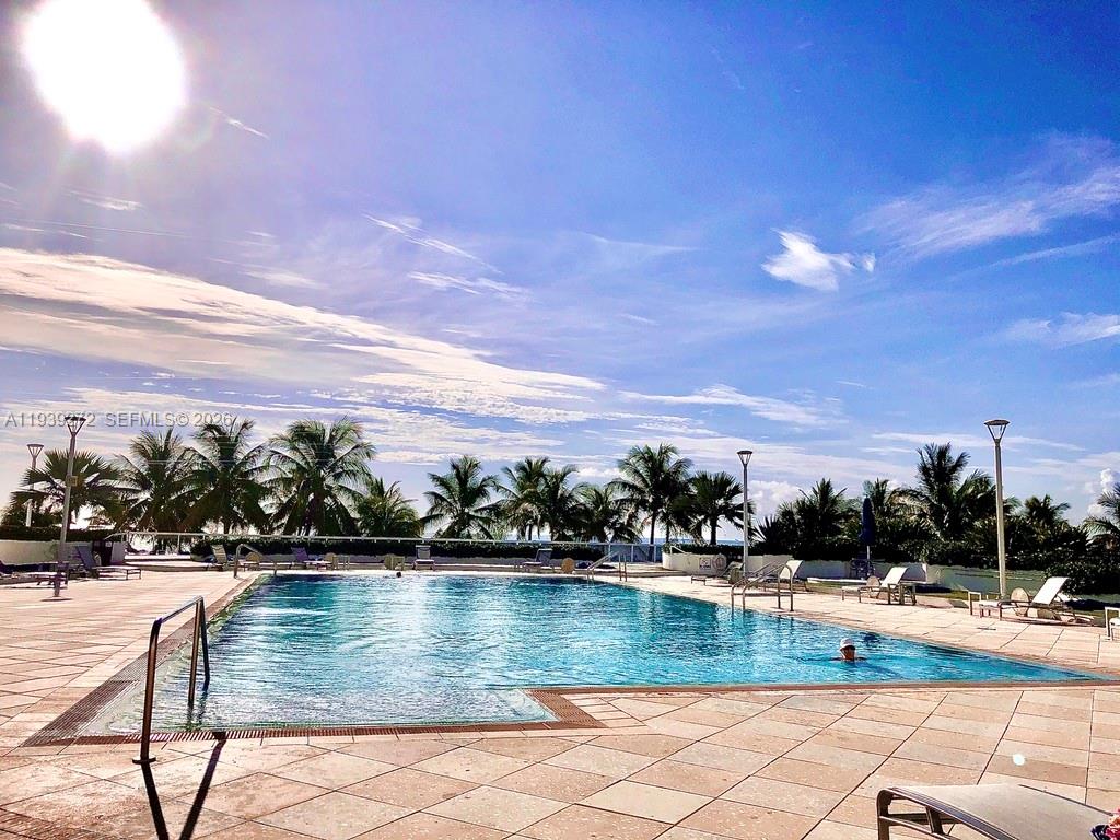 100 Lincoln Road, Unit 1230 Miami Beach, FL 33139 - Photo 23 of 38 a view of swimming pool with outdoor seating and plants