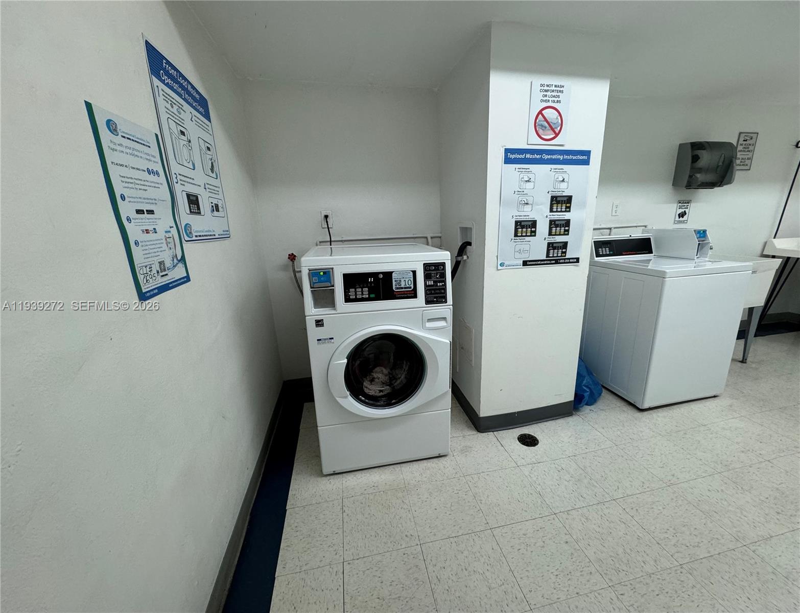 100 Lincoln Road, Unit 1230 Miami Beach, FL 33139 - Photo 38 of 44 a utility room with dryer and washer