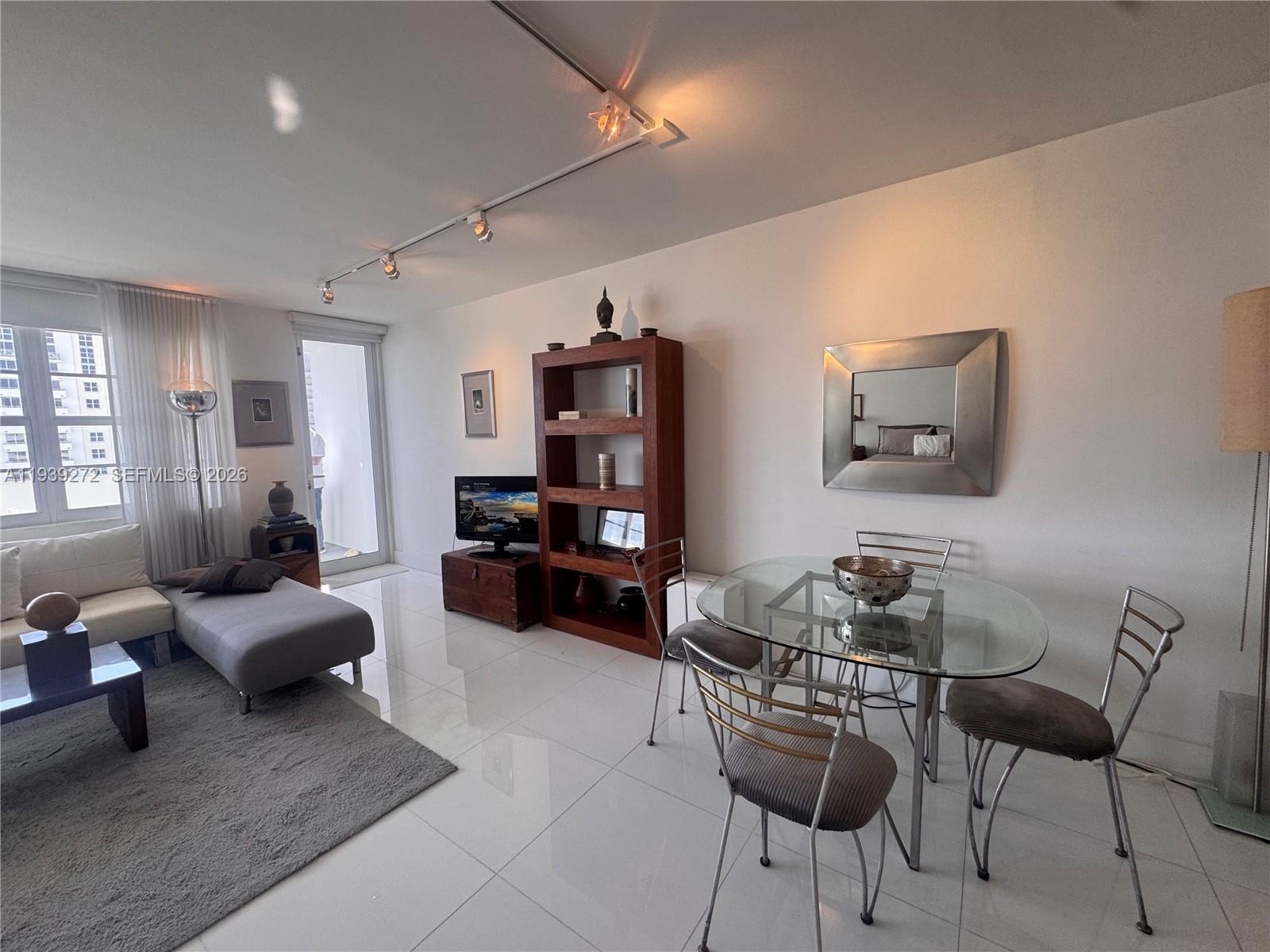 100 Lincoln Road, Unit 1230 Miami Beach, FL 33139 - Photo 8 of 38 a living room with furniture and wooden floor