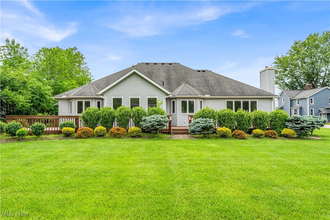 5327 Jaycox Road North Ridgeville, OH 44039 - Photo 32 of 36 Back of house featuring a wooden deck and a lawn