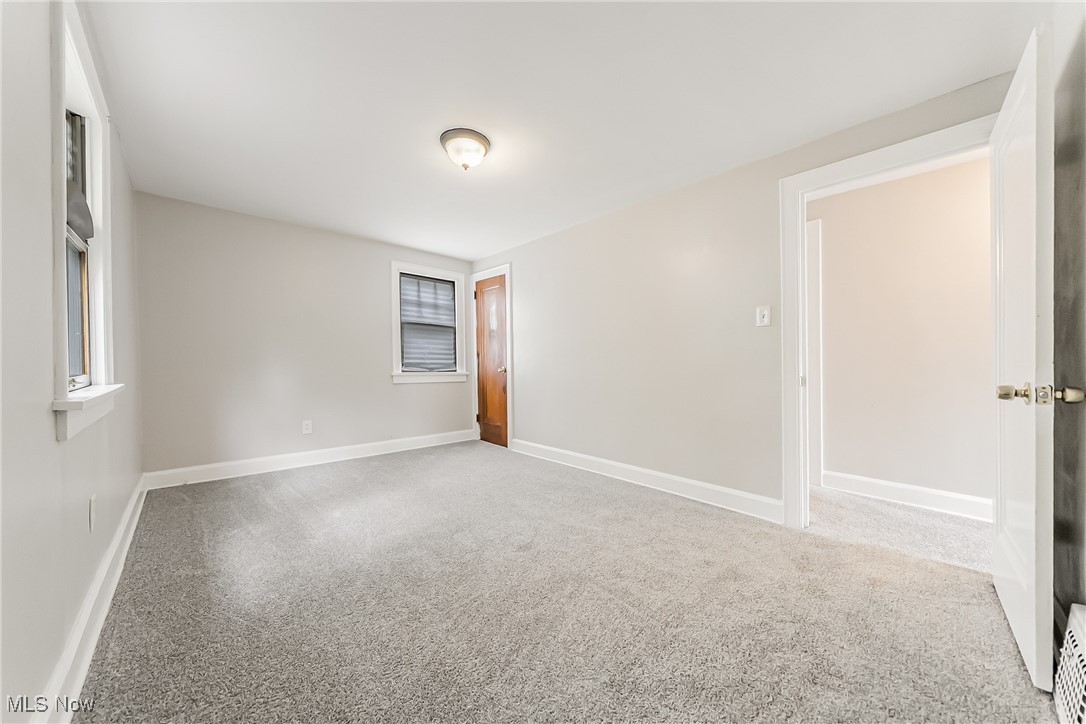 1271 Winston Road Cleveland, OH 44121 - Photo 23 of 43 Carpeted spare room with baseboards