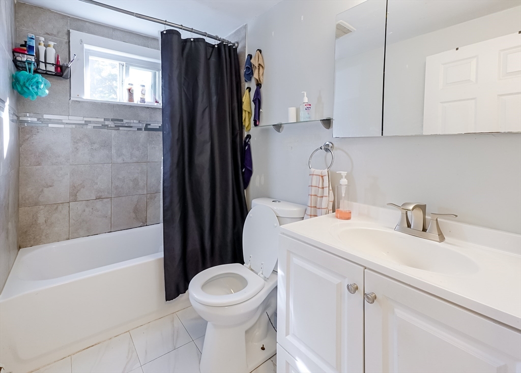 5 Oliver Street Randolph, MA 02368 - Photo 15 of 29 a bathroom with a sink toilet and shower