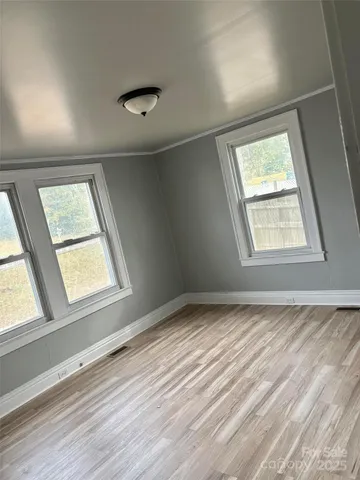 a view of an empty room and window